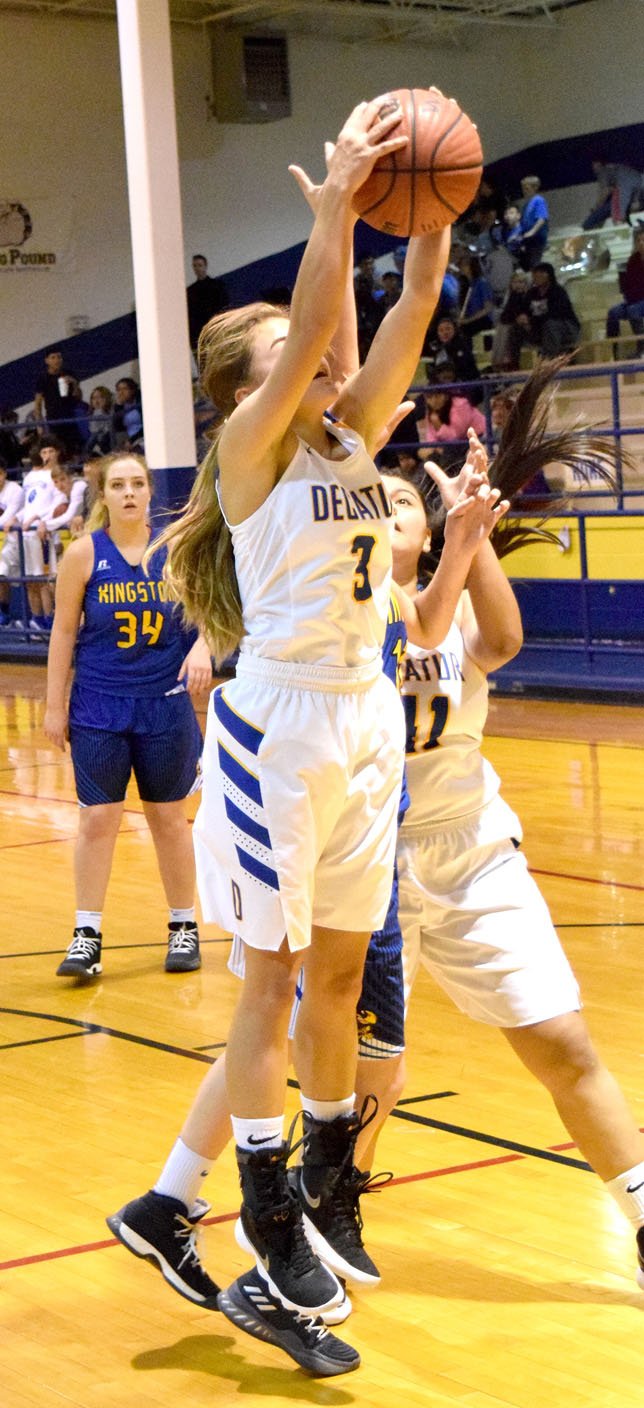 Westside Eagle Observer/MIKE ECKELS Destiny Mejia (Decatur 3) pulls down a rebound during the second quarter of the Decatur-Kingston conference game at Peterson Gym in Decatur Dec. 5.
