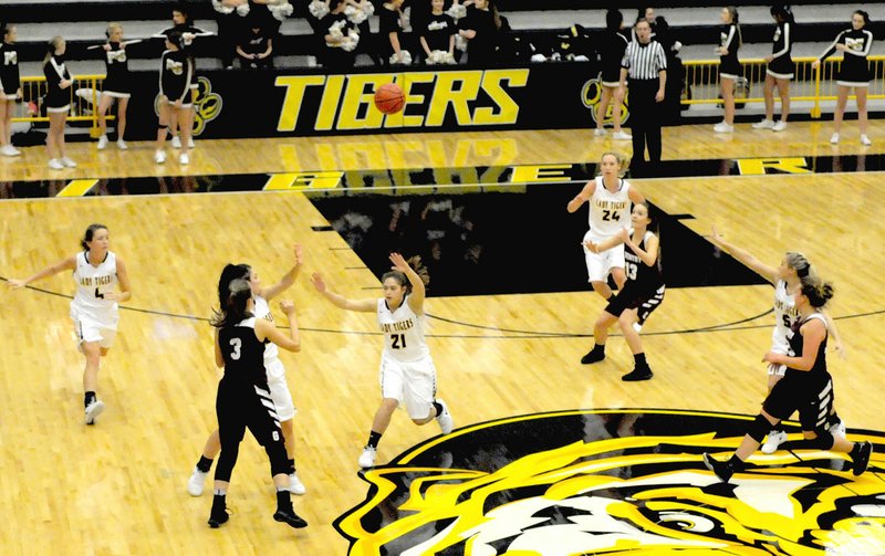 Enterprise-Leader/MARK HUMPHREY Gentry's Jaydon Jarnagan tries to thwart a Prairie Grove half-court trap by passing the ball to Ariel Nix in the post. The Lady Pioneers won on a last-second driving-to-the-basket shot by Haley Hays Friday. The final score was Gentry 25, Prairie Grove 23.