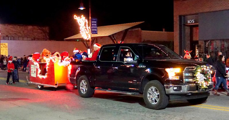 Westside Eagle Observer/RANDY MOLL A neighborhood group, Friends and Neighbors from S. Little Avenue, entered a float in the Gentry Christmas parade on Saturday.