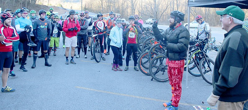 Keith Bryant/The Weekly Vista Mayor Peter Christie (right) stands aside as Mike Rush, owner of Rush Running, briefs racers before the ride starts Sunday morning.