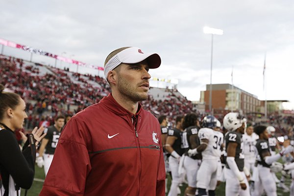 Washington State defensive coordinator Alex Grinch walks on the field after an NCAA college football game against Nevada in Pullman, Wash., Saturday, Sept. 23, 2017. (AP Photo/Young Kwak)


