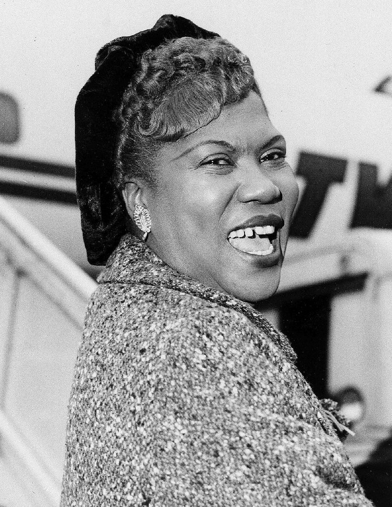 American singer-songwriter Sister Rosetta Tharpe arrives at London Airport, Nov. 20, 1957 to sing rock 'n roll hymns from London to Harrogate, Yorkshire. 