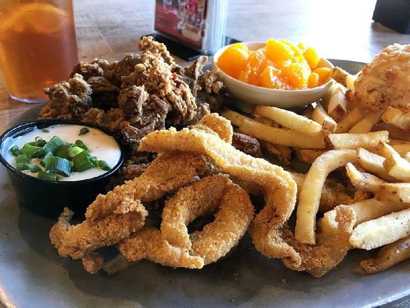 Shorty Small’s “Make Yer Own Combo” plates let customers mix and match barbecue, fried shrimp, smoked sausage fried catfish (shown here with fried chicken livers, fries and mandarin oranges). 