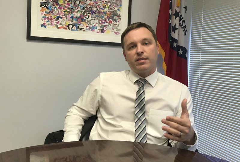 In this Monday, Dec. 11, 2017 photo, Jared Henderson, the former executive director of Teach for America's Arkansas branch, speaks in Little Rock, Ark. Henderson announced Tuesday, Dec. 12, 2017 that he's seeking the Democratic nomination to challenge Republican Gov. Asa Hutchinson in 2018. (AP Photo/Andrew Demillo)