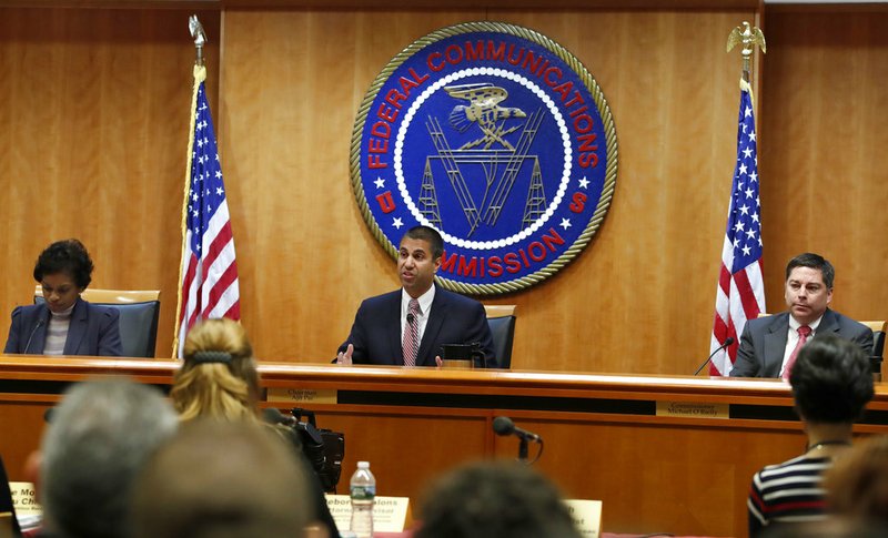 Associated Press/JACQUELYN MARTIN
Federal Communications Commission (FCC) Chairman Ajit Pai, center, announces the vote was approved to repeal net neutrality, next to Commissioner Mignon Clyburn, left, who voted no, and Commissioner Michael O'Rielly, who voted yes, at the FCC, Thursday, Dec. 14, 2017, in Washington. 