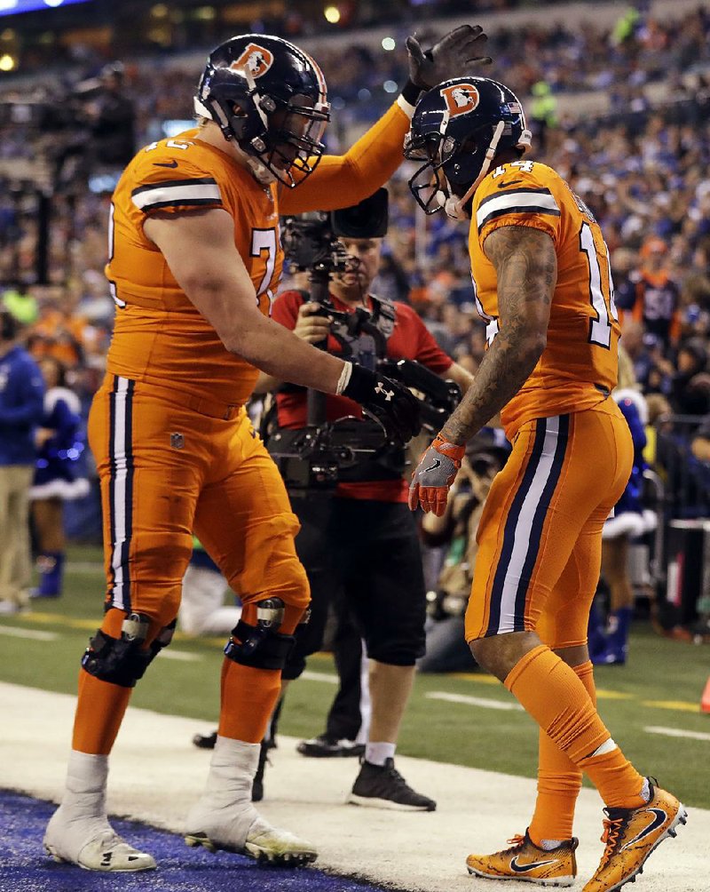 Denver wide receiver Cody Latimer (right) celebrates with offensive tackle Garrett Bolles after scoring a touchdown during the second half of the Broncos’ 25-13 victory over the Indianapolis Colts on Thursday at Lucas Oil Stadium in Indianapolis.