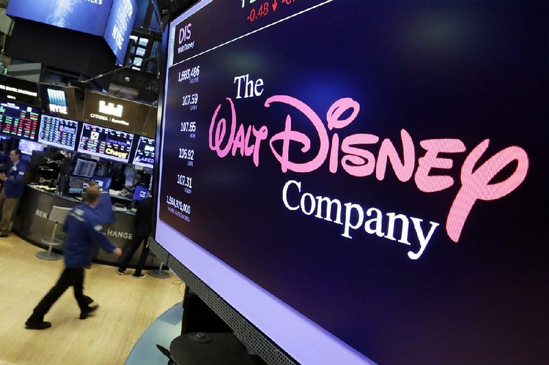 The Walt Disney Co. logo is on display this summer at the New York Stock exchange. Disney is buying a large part of the Rupert Murdoch family’s Twenty-First Century Fox Inc.