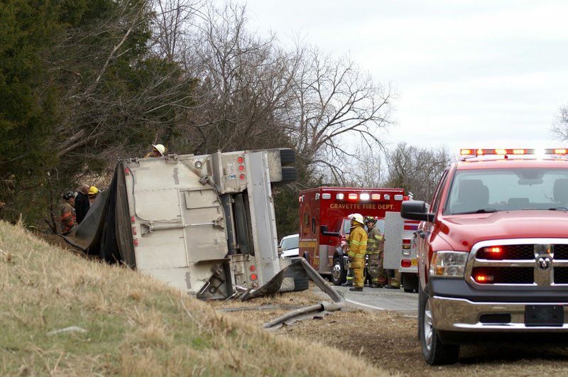 NWA Democrat-Gazette/RANDY MOLL
Rescue workers from multiple agencies worked to free the victims of a two-vehicle crash on Arkansas Highway 43 just south of the Spavinaw Creek Bridge on Thursday morning (Dec. 14, 2017). Highway 43 was closed for several hours.