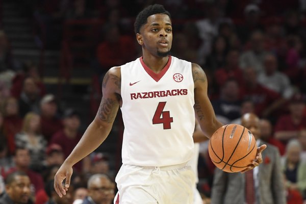 Arkansas guard Daryl Macon brings the ball up court against Minnesota in the first half of an NCAA college basketball game Saturday, Dec. 9, 2017 in Fayetteville, Ark. (AP Photo/Michael Woods)

