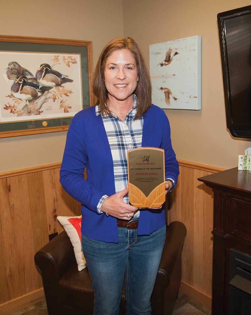 Jennifer James of Newport holds her award from Field to Market for being named 2017 Farmer of the Year. The award was presented to James in recognition of her farm’s sustainability and conservation and stewardship efforts.