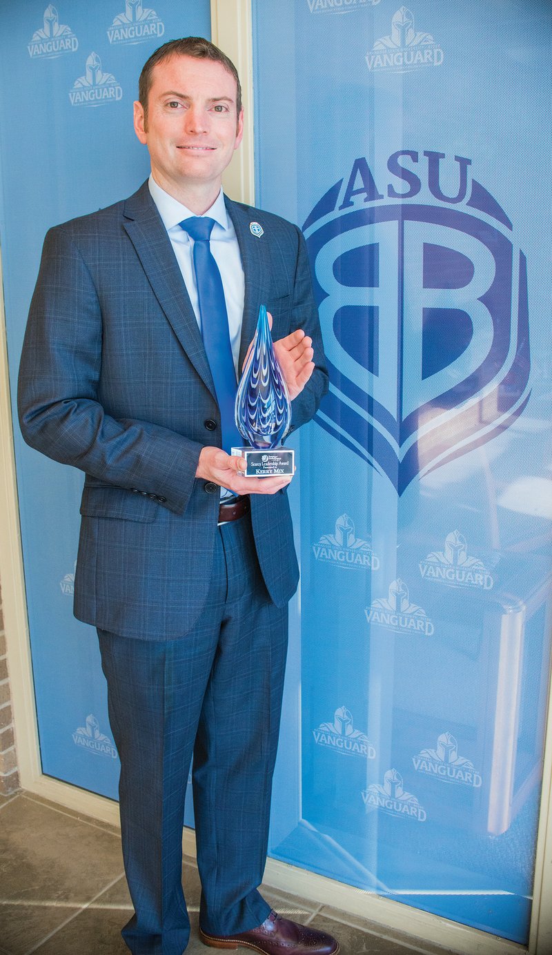 Kerry Mix, provost of Arkansas State University-Beebe, holds the inaugural Leadership Searcy Leadership Award he received at the Searcy Regional Chamber of Commerce banquet. Mix was chosen by his fellow leadership-class members, who were asked to nominate “someone you feel has most fulfilled the mission of leadership by becoming involved in our chamber and community.