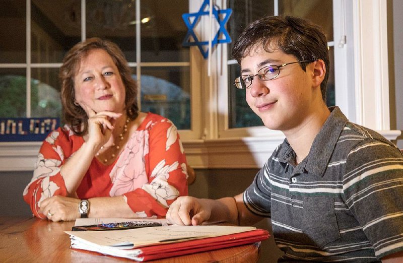Each year sophomore Eli Sporn, at home with his mother, Melissa Sporn, misses school for Rosh Hashanah and Yom Kippur. School districts in northern Virginia are beginning to recognize Muslim and Jewish holidays with updated attendance and test policies.
