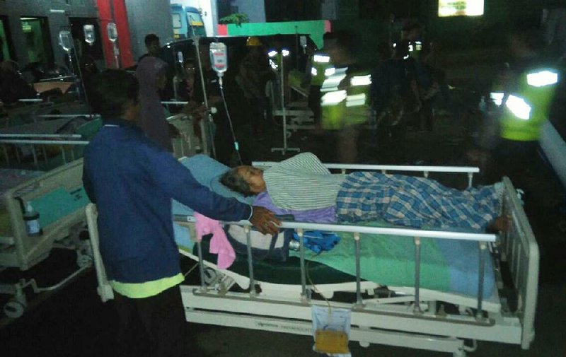 A patient is evacuated from a hospital in Banyumas, Indonesia, this morning after Friday’s earthquake.  
