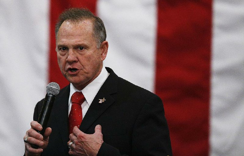 In this Dec. 11, 2017, file photo, U.S. Senate candidate Roy Moore speaks at a campaign rally in Midland City, Ala. 