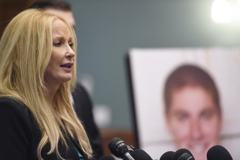 District Attorney Stacy Parks Miller holds a news conference regarding a grand jury's report in the wake of a fraternity pledge's drinking death on Friday, Dec. 15, 2017 at the Courthouse Annex in Bellefonte, Pa.  Twenty-six people face criminal charges related to the Feb. 4 death of 19-year-old Tim Piazza, after he consumed a dangerous amount of alcohol during a pledge bid night. (Phoebe Sheehan/Centre Daily Times via AP)