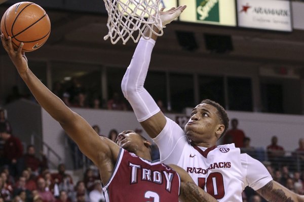 Arkansas forward Daniel Gafford (10) goes for a block against Troy guard Darian Adams (2) during a game Saturday, Dec. 16, 2017, in North Little Rock. 