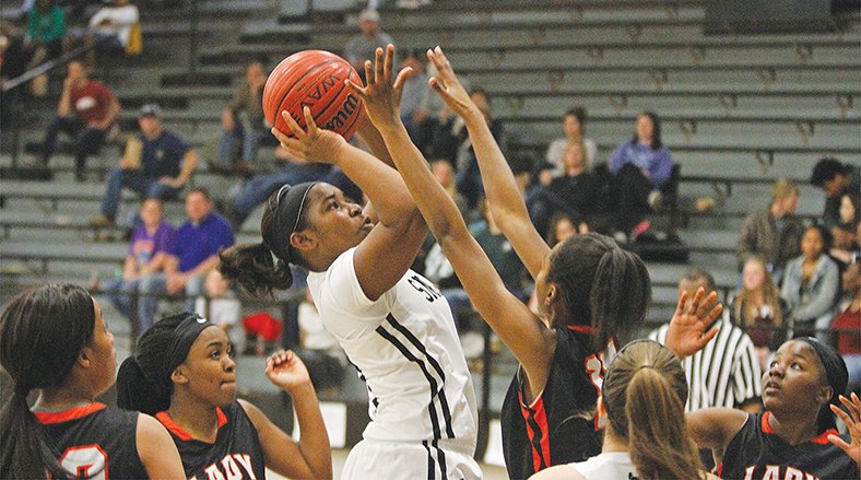 Terrance Armstard/News-Times Smackover's Sharnes McGhee shoots the ball during the Lady Bucks' game against Warren on Friday night at Smackover. The Lady Lumberjacks knocked off Smackover 47-40.