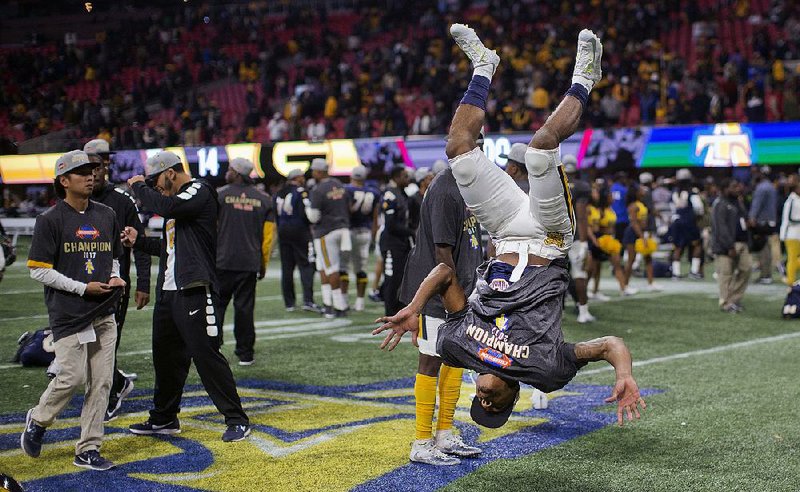 North Carolina A&T players celebrate after beating Grambling State 21-14 in the Celebration Bowl on Saturday in Atlanta. The victory was North Carolina A&T’s second in the Celebration Bowl in the past three years. 