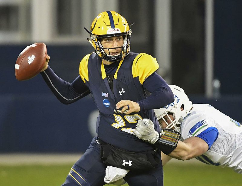 Texas A&M-Commerce Lions quarterback Luis Perez (12) completed 23 of 30 passes for 323 yards and 2 touchdowns in leading Texas A&M-Commerce to a 37-27 victory over West Florida in the NCAA Division II championship game. 