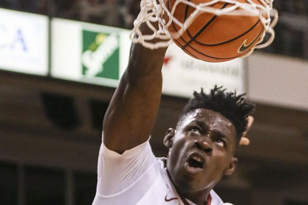 Arkansas forward Adrio Bailey dunks the ball during a game against Troy on Saturday, Dec. 16, 2017, in North Little Rock. 