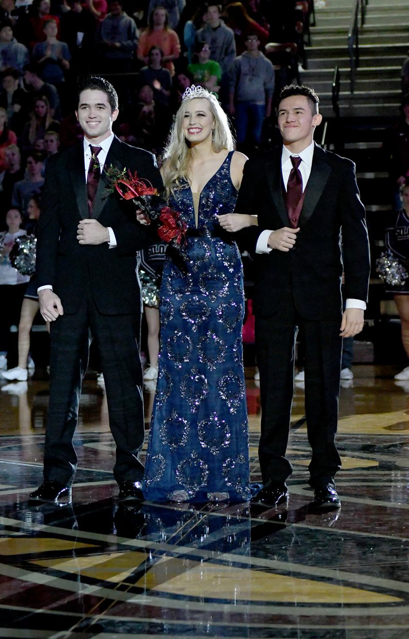 Bud Sullins/Special to the Siloam Sunday Siloam Springs senior Emily McClelland was crowned the 2017-18 Winter Homecoming Queen on Friday at a coronation assembly inside Panther Activity Center. Pictured with McClelland are SSHS basketball co-captains Spencer Lashley, left, and Diego Flores, right. For more basketball coverage, see Page 4 of today's paper, and read the Herald-Leader on Wednesday, Dec. 20, for a special homecoming section.
