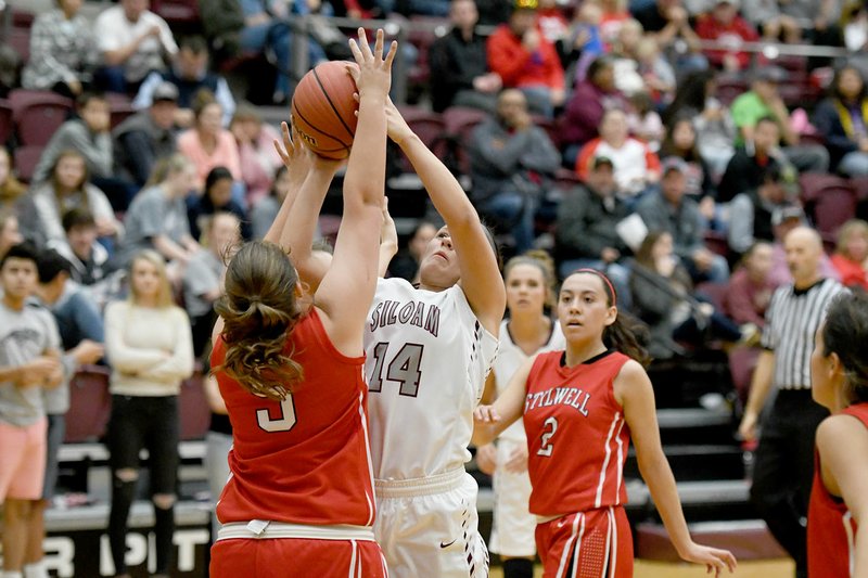 Bud Sullins/Special to Siloam Sunday Siloam Springs senior Morgan Vaughn shoots over Stilwell, Okla., defender Julia Bruner during Friday's girls homecoming game inside Panther Activity Center. Vaughn scored 28 points and the Lady Panthers defeated the Lady Indians 56-39.