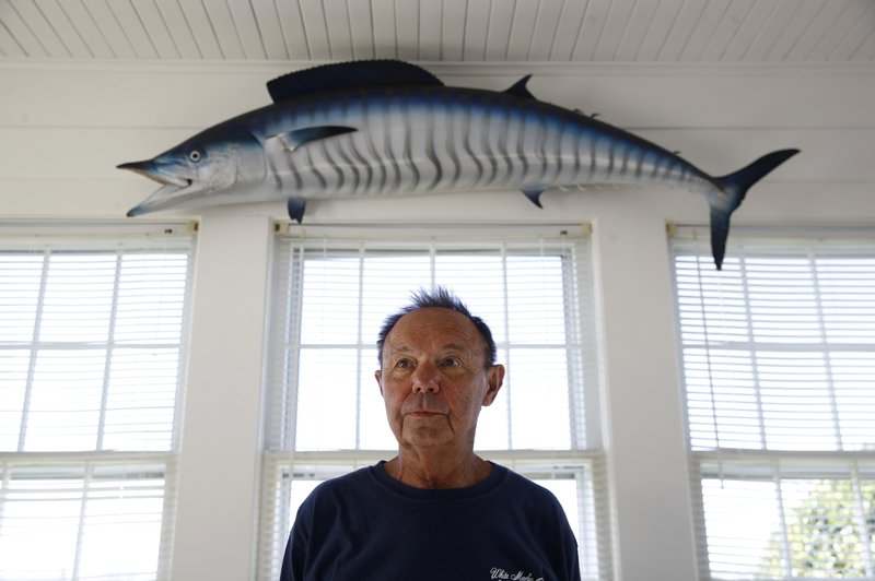 In this Nov. 2, 2017 photo, Jim Motsko, founder of the White Marlin Open fishing tournament, stands in his home in Ocean City, Md. "I kind of call it the velvet hammer," Motsko said of the use of lie-detector tests in fishing tournaments. "You need something to keep people honest." (AP Photo/Patrick Semansky)