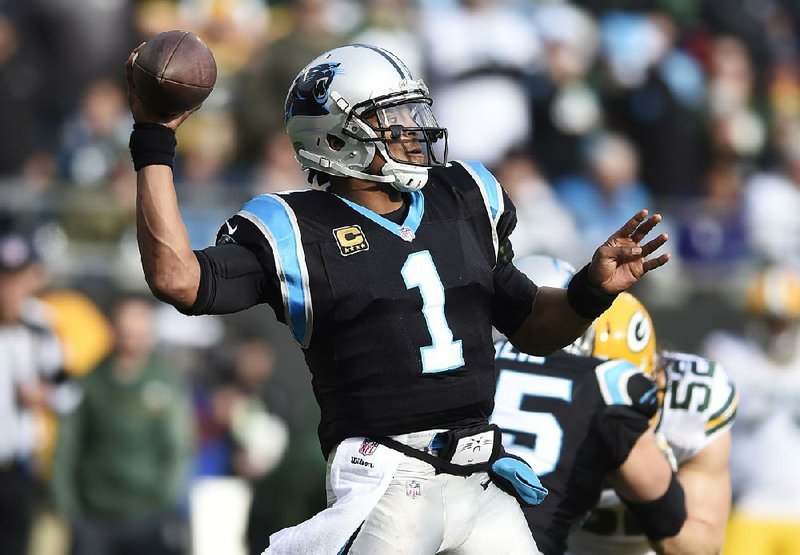 Carolina Panthers quarterback Cam Newton (1) threw for 242 yards and four touchdowns in the Panthers’ 31-24 victory over the Green Bay Packers on Sunday.