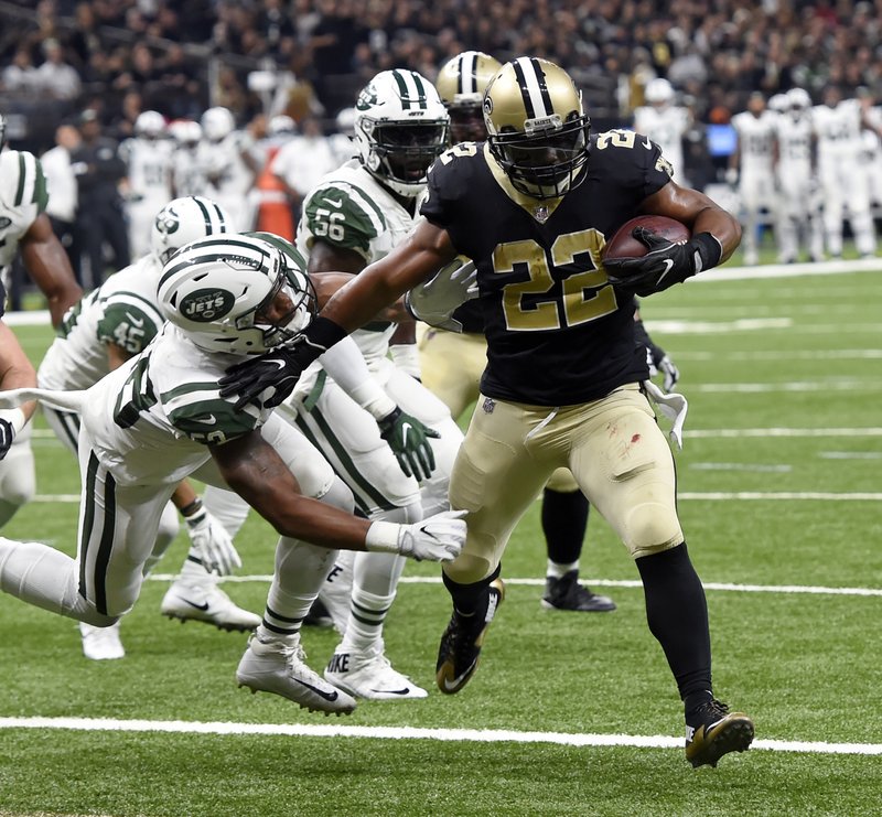 New Orleans Saints running back Mark Ingram (22) carries for a touchdown against New York Jets inside linebacker Darron Lee in the first half of an NFL football game in New Orleans, Sunday, Dec. 17, 2017. 