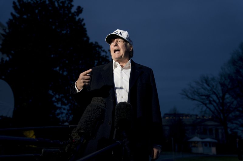 President Donald Trump speaks to members of the media on the South Lawn at the White House in Washington, Sunday, Dec. 17, 2017, after returning from Camp David in Maryland. Trump says he's not planning to fire special counsel Robert Mueller. (AP Photo/Andrew Harnik)