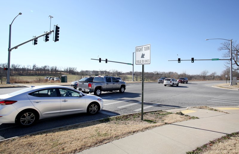 Traffic travels through the intersection of Rupple Road and Mount Comfort Road on Wednesday in Fayetteville. Crews will start next year on making a number of improvements to Rupple Road from Starry Night View to Mount Comfort Road.