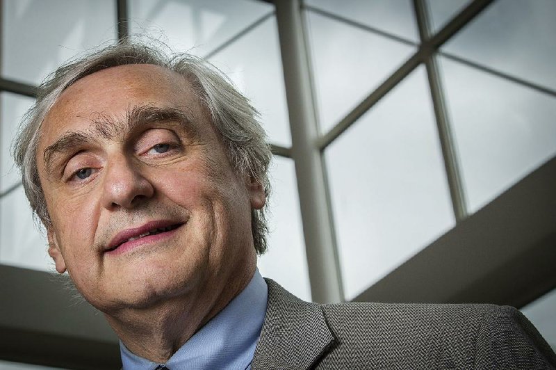 In this July 24, 2014, file photo, then-Chief Judge of the U.S. Court of Appeals for the Ninth Circuit Alex Kozinski poses for a portrait in the lobby of a Washington office building. 