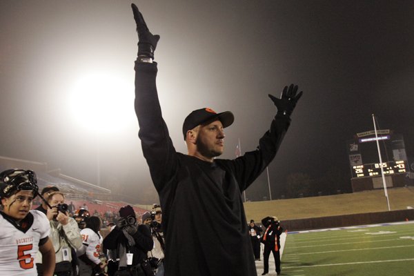 Gilmer head coach Jeff Traylor holds his hands up during the second half of the Texas High School UIL Class 3A Championship football game against Abilene Wylie in Dallas on Saturday, Dec. 12, 2009. Gilmer won 43-26. (AP Photo/Mike Fuentes)

