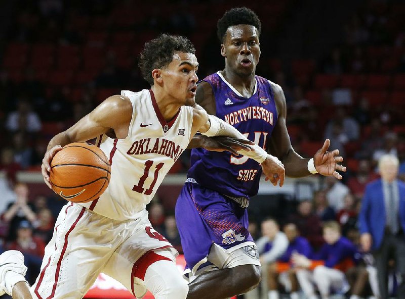 Oklahoma guard Trae Young (11) tied an NCAA Division I record with 22 assists in Oklahoma’s 105-68 victory over Northwestern State on Tuesday night.