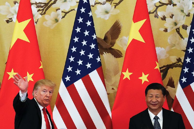 President Donald Trump meets with Chinese counterpart Xi Jinping in Beijing last month. While Trump has cultivated a warm relationship with Xi, his speech Monday labeling China as a rival sparked criticism of what the Chinese called “outdated, zero-sum thinking.”  