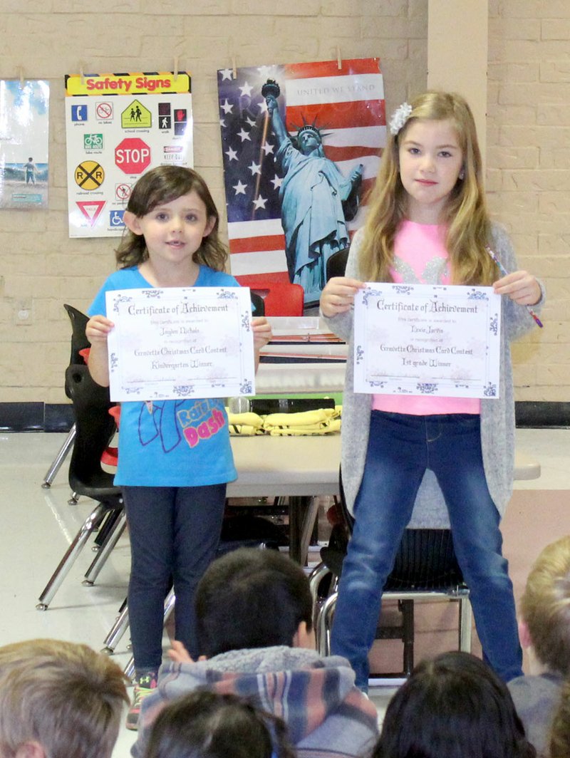 Westside Eagle Observer/SUBMITTED Jayden Nichols and Lexie Jarvis were Glenn Duffy Elementary School winners in the Gravette school district's annual Christmas card contest in which students design the greeting cards sent out by the district. Laken Ellis (not pictured) was another Glenn Duffy winner and was also the overall school winner in the contest.