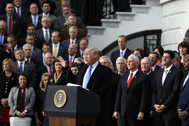 Associated Press/EVAN VUCCI President Donald Trump speaks during a bill passage event on the South Lawn of the White House in Washington, Wednesday, Dec. 20, 2017, to acknowledge the final passage of tax overhaul legislation by Congress.