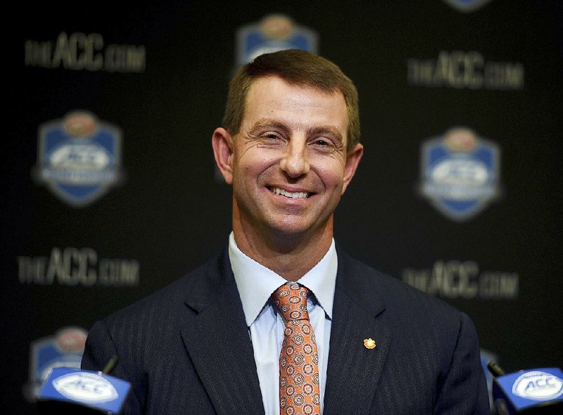 In a Dec. 1, 2017 file photo, Clemson coach Dabo Swinney smiles during an NCAA college football press conferences for the Atlantic Coast Conference championship game against Miami at Bank of America Stadium. 