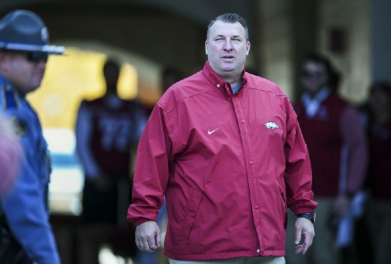 Bret Bielema makes his way out onto the field in the first half during a football game on Friday, November 24, 2017 at Razorback Stadium in Fayetteville.

