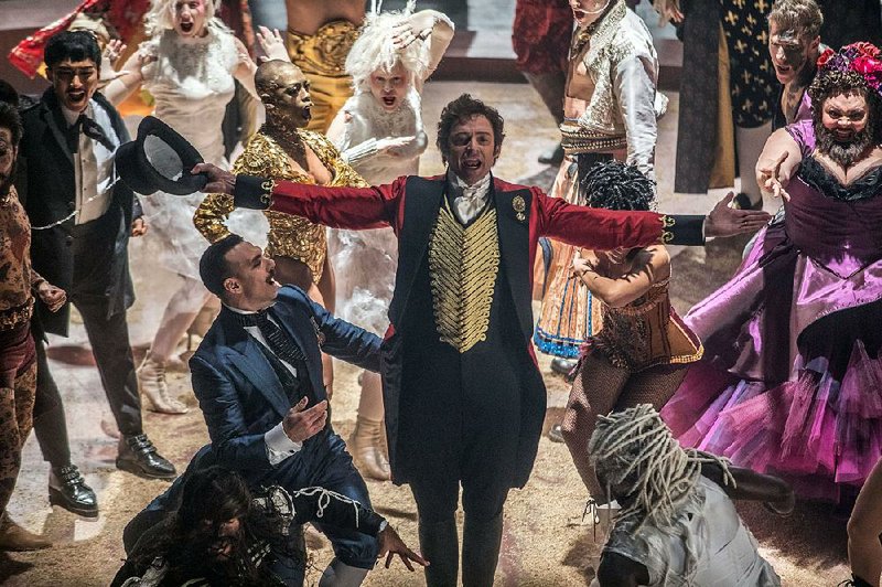 “No one ever made a difference by being like everyone else”: P.T. Barnum (Hugh Jackman) belts out a song accompanied by his circus performers in The Greatest Showman.