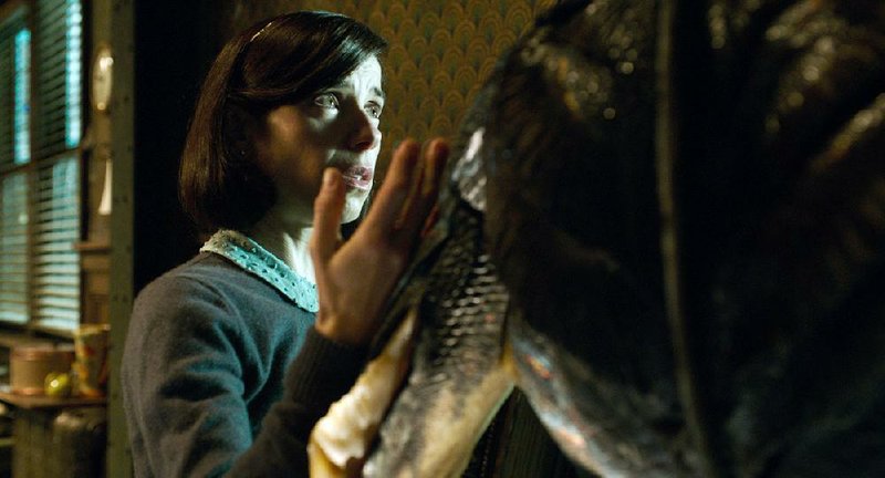 Mute custodian Elisa (Sally Hawkins) has no trouble communicating with an “asset” (Doug Jones) trapped inside a secret government laboratory in Guillermo del Toro’s genre-crossing romance The Shape of Water.