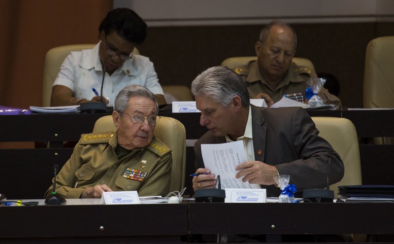 Cuba President Raul Castro, front left, speaks with his first vice-president Miguel Diaz-Canel during a session of the National Assembly in Havana, Cuba, Thursday, Dec. 21 2017. 