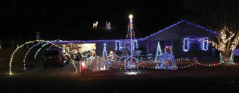 Seth Brown, 15, of Searcy decorated his home at 1301 Wallis Drive. and programmed the lights to flash with music that is broadcast on 95.5 FM.
