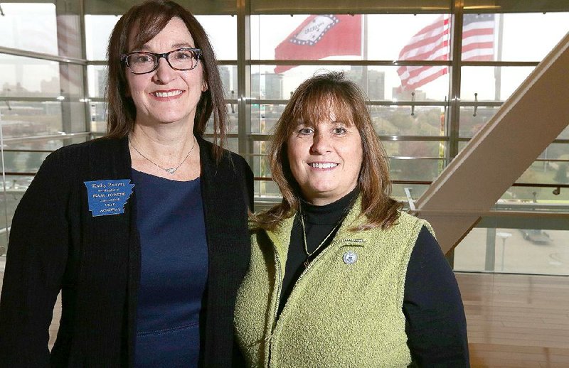 Kathy Powers (left) and Dianna Chambers are heading up  the of  the All Services Academies Holiday Ball that will be held Friday at the Clinton Presidential Center. Both women have sons at the United States Air Force Academy in Colorado Springs, Colo.