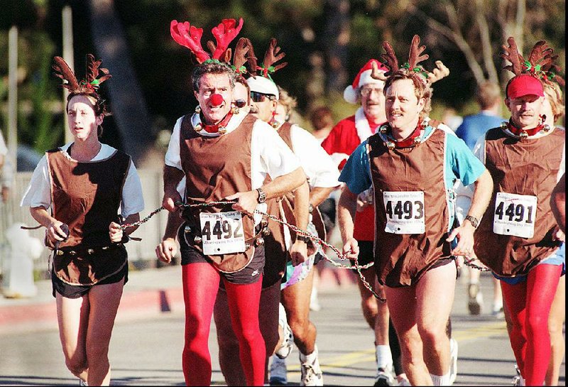 Members of the Rudolph Freethinkers Society of Brookings, S.D., hold their annual “Free Rudolph” 10K to educate the public about the true story of the “reindeer” and counter the cult of ungulate worship that has sprung up around him.Fayetteville-born Otus the Head Cat’s award-winning column of humorous fabrication appears every Saturday.

