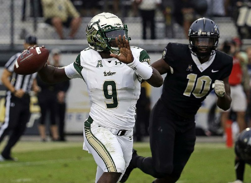 South Florida quarterback Quinton Flowers needs 47 yards to break the American Athletic Conference’s career record for total offense as he leads the No. 23 Bulls against Texas Tech in the Birmingham Bowl.