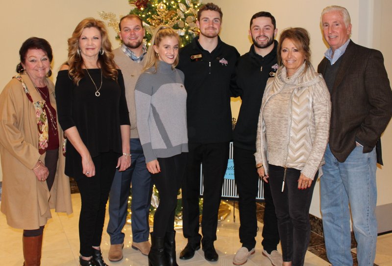 NWA Democrat-Gazette/CARIN SCHOPPMEYER Anna Anderson (from left); Annalee Falk; Jacob Thompson; Mallory Lindberg and Luke Falk, 2017 Burlsworth Trophy winner; Baker Mayfield; and Gina and James Mayfield gather at the Burlsworth Foundation reception Dec. 3 at The Apollo in Springdale.