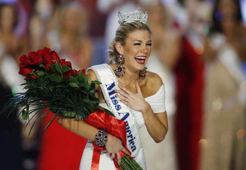 FILE - In this Jan. 12, 2013 file photo, Miss New York Mallory Hytes Hagan reacts as she is crowned Miss America 2013 in Las Vegas. Some former Miss Americas shamed in emails from the pageant&#x2019;s CEO are calling on him and other leaders of the Miss America Organization to resign. Hagan&#x2019;s appearance and sexual habits were mocked in the emails.  (AP Photo/Isaac Brekken, File)