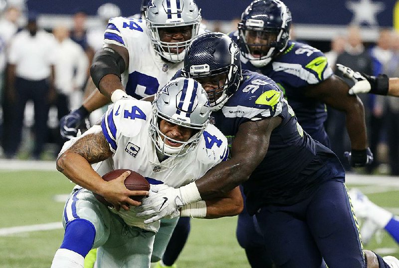 Passing on postseason Cowboys eliminated, while Seahawks