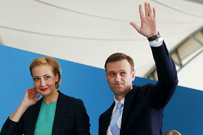 Russian opposition leader Alexei Navalny and his wife, Yulia, attend a meeting of supporters in Moscow on Sunday, during which he was nominated for the country’s presidential race.
